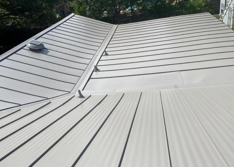 Solar attic fan installed on a metal roof for Roof Ventilation in Garden Grove